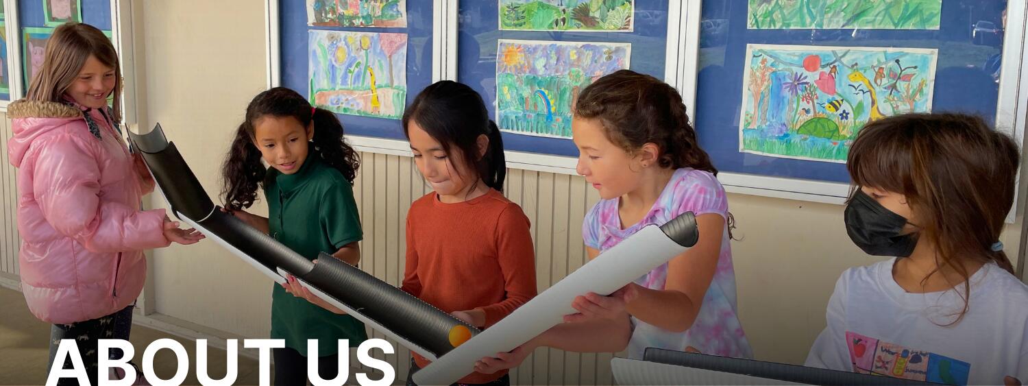 about us banner photo of students working together 